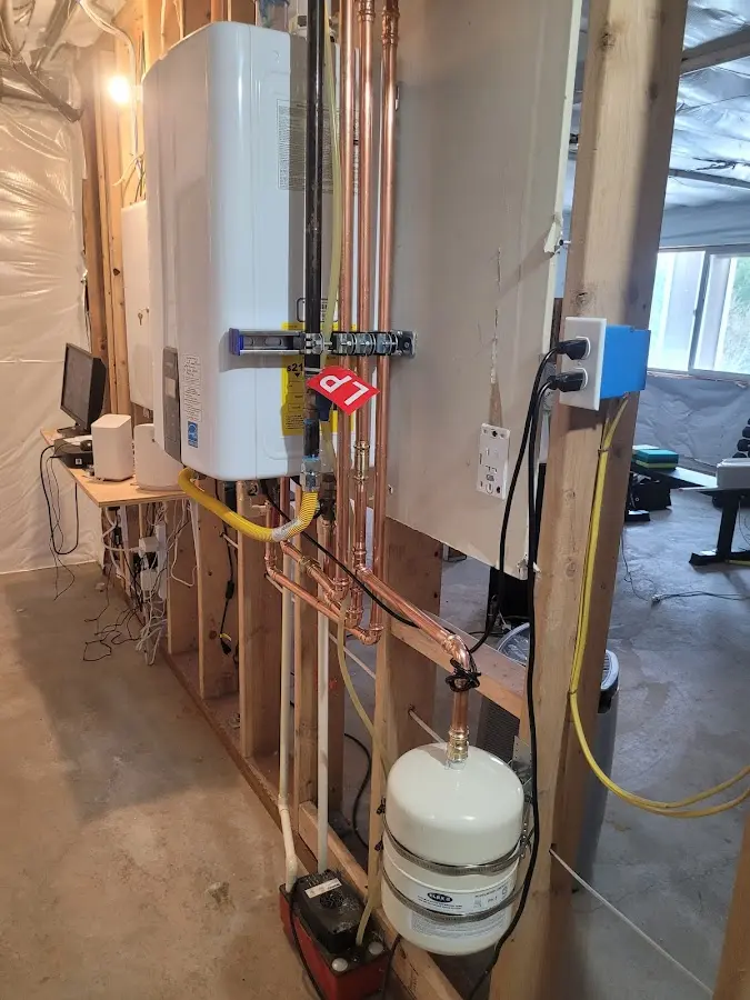 Licensed plumber repairing a kitchen sink in Ross